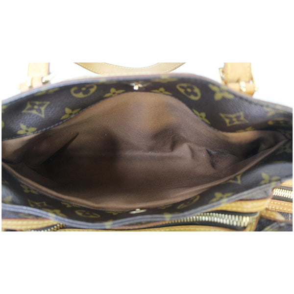 wide interior Louis Vuitton Riveting Monogram Canvas