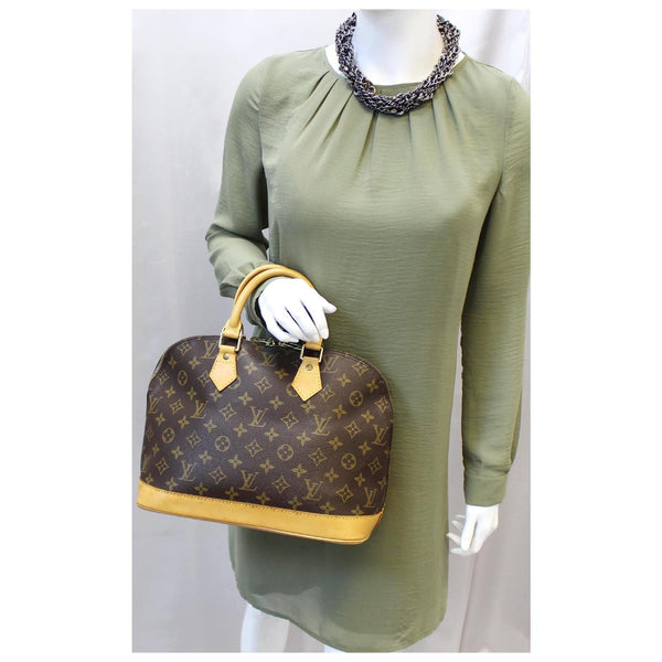 Louis Vuitton Alma Monogram Canvas Satchel Bag Brown for women