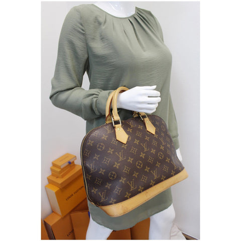 Louis Vuitton Alma Monogram Canvas Satchel Bag Brown for women