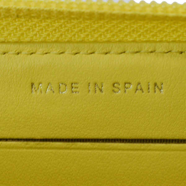 CHANEL Boy Caviar Quilted Zip Around Wallet Yellow