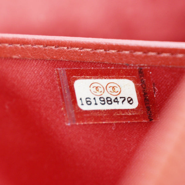 CHANEL Zippy Camellia Embossed Leather Wallet Red