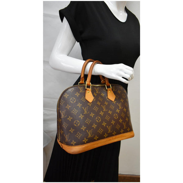LOUIS VUITTON Alma Monogram Canvas Satchel Bag Brown