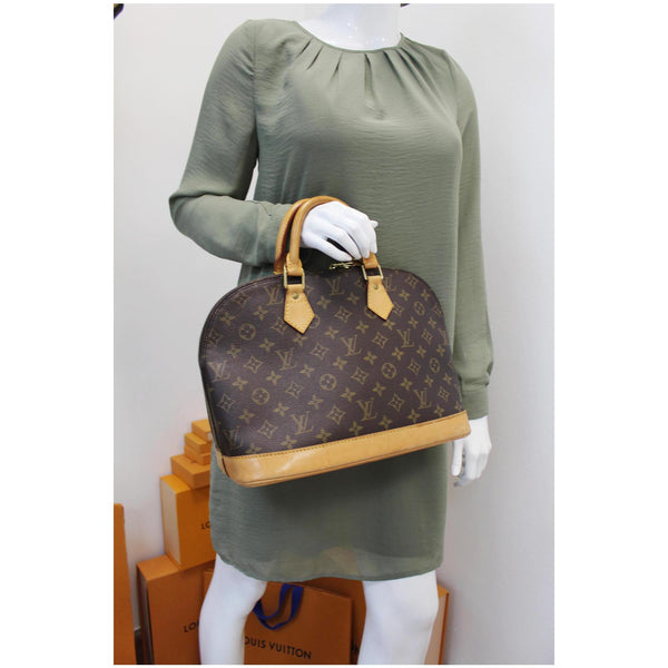 Louis Vuitton Alma Monogram Canvas Satchel Bag Brown - women