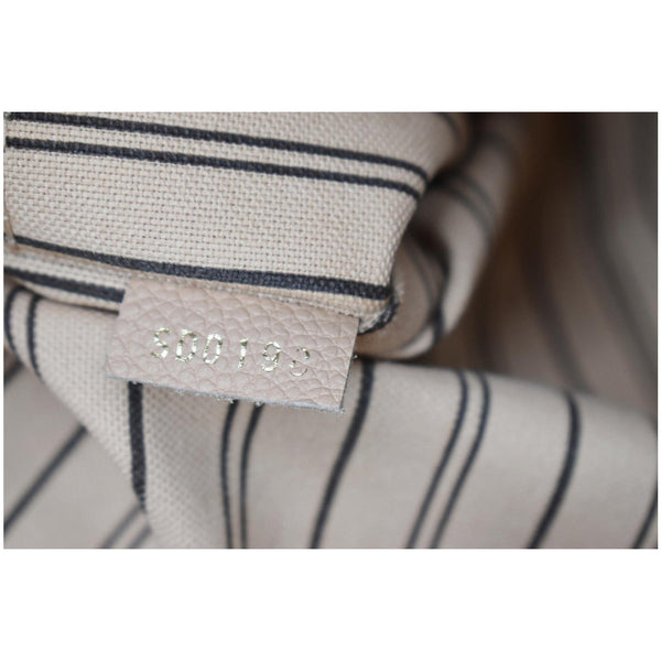 LOUIS VUITTON Melie Empreinte Leather Hobo Bag Beige