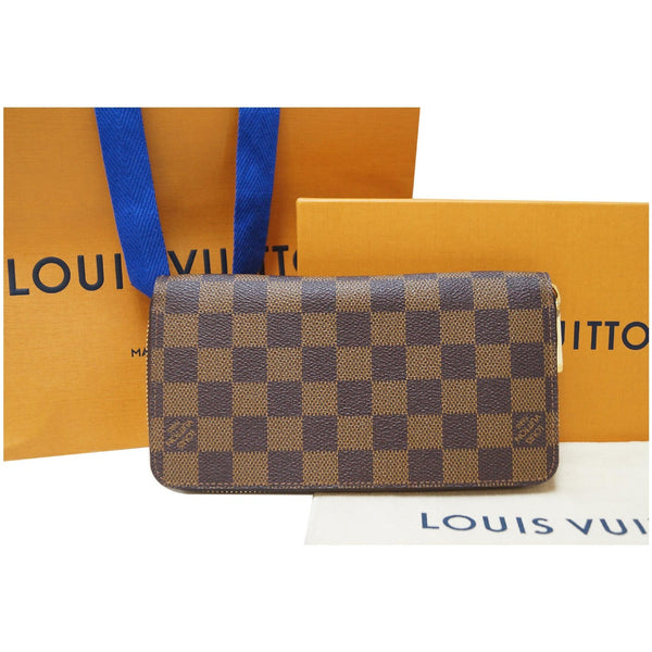 LOUIS VUITTON Zip Around Damier Ebene Wallet Brown