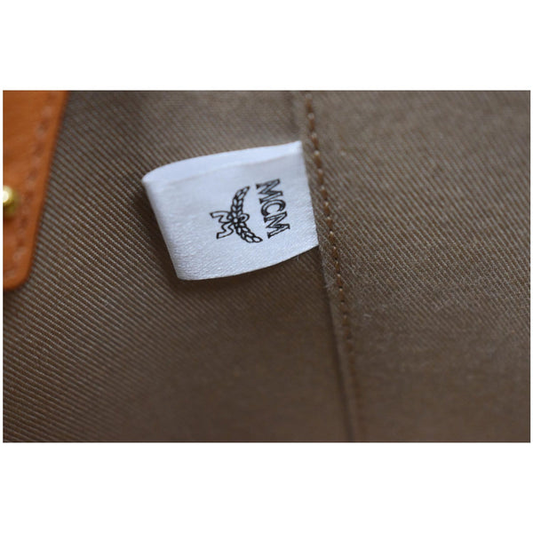 MCM Small Cylinder Visetos Monogram Leather Crossbody Bag Cognac