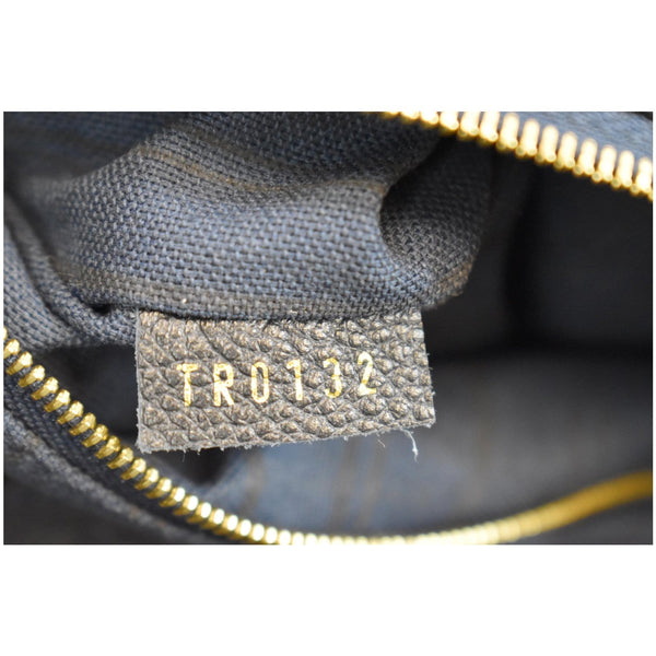 Louis Vuitton Artsy MM Empreinte Leather Shoulder Bag serial code