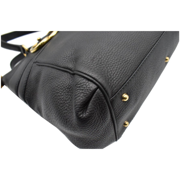 Gucci Ride Medium Pebbled Leather Top Handle bag metal feet