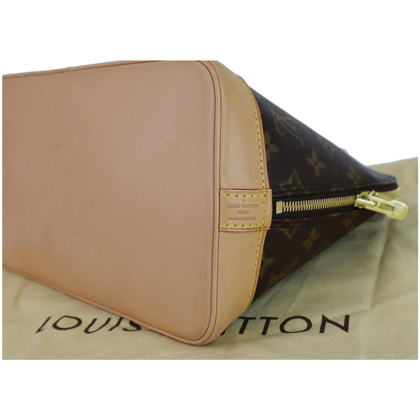 Louis Vuitton Alma Monogram Canvas Satchel Handbag offwhite corner look