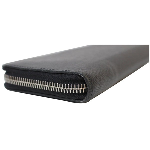 side pose lv Zippy Wallet Vertical Taiga leather
