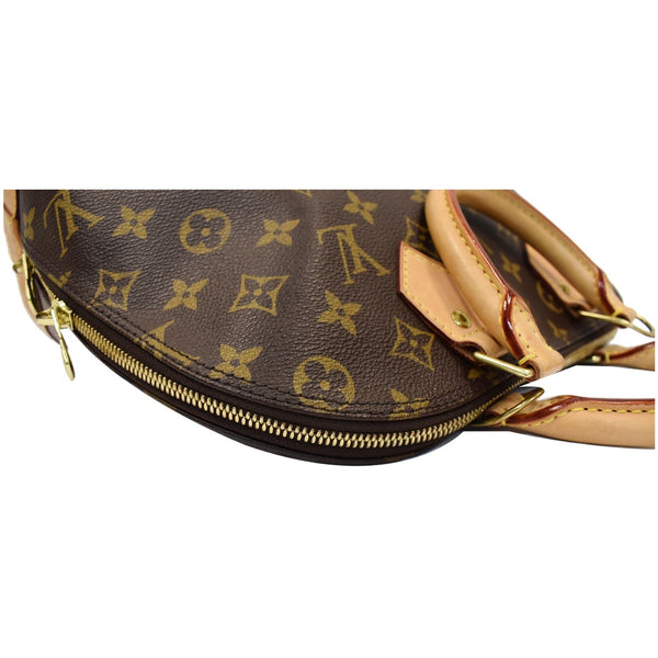 Louis Vuitton Alma Monogram Canvas Satchel Bag Brown - top corner look
