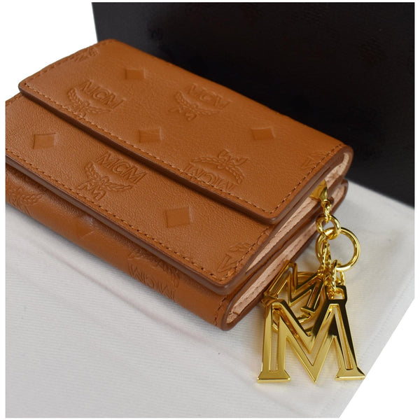 MCM Klara Trifold Mini Monogram Leather Charm Wallet Cognac