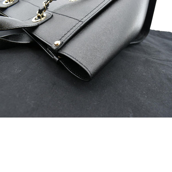 Chanel Studded Deauville Caviar Leather Tote Bag in Black - Left Side