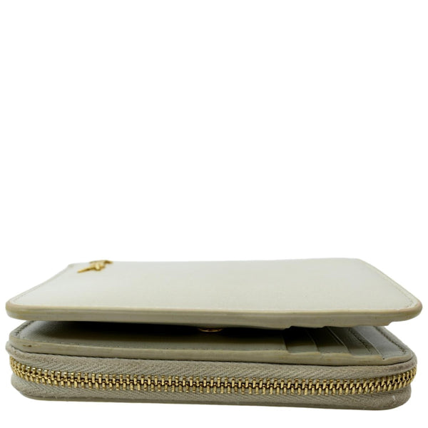 YVES SAINT LAURENT Tiny Monogram Compact Leather Zip Around Wallet White