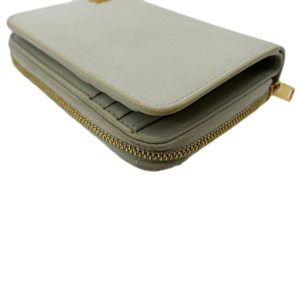 YVES SAINT LAURENT Tiny Monogram Compact Leather Zip Around Wallet White