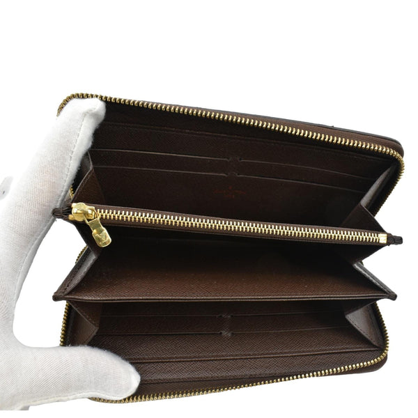 LOUIS VUITTON Zip Around Damier Ebene Wallet Brown