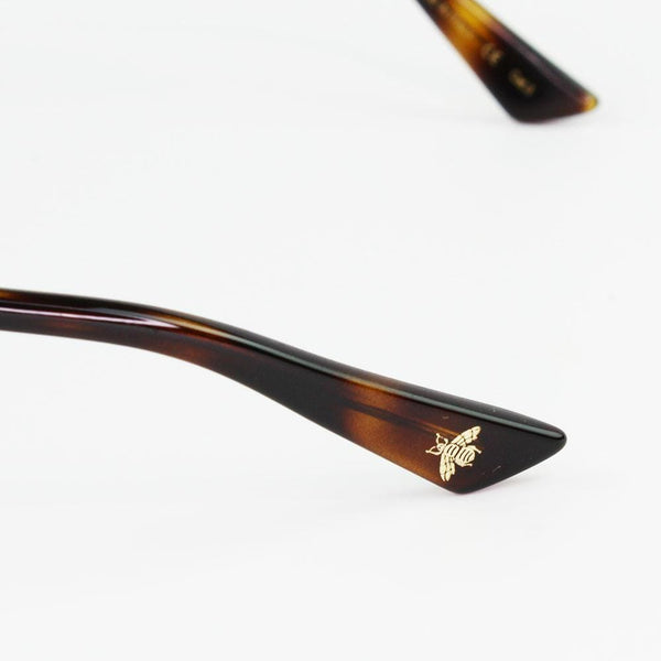 Gucci GG0320S 001 Black/Gold Frame Sunglasses logo