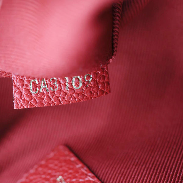 LOUIS VUITTON Saintonge Monogram Empreinte Leather Crossbody Bag Red