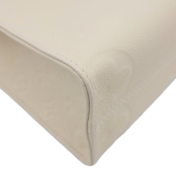 LOUIS VUITTON Onthego PM Monogram Empreinte Leather Shoulder Bag Off White