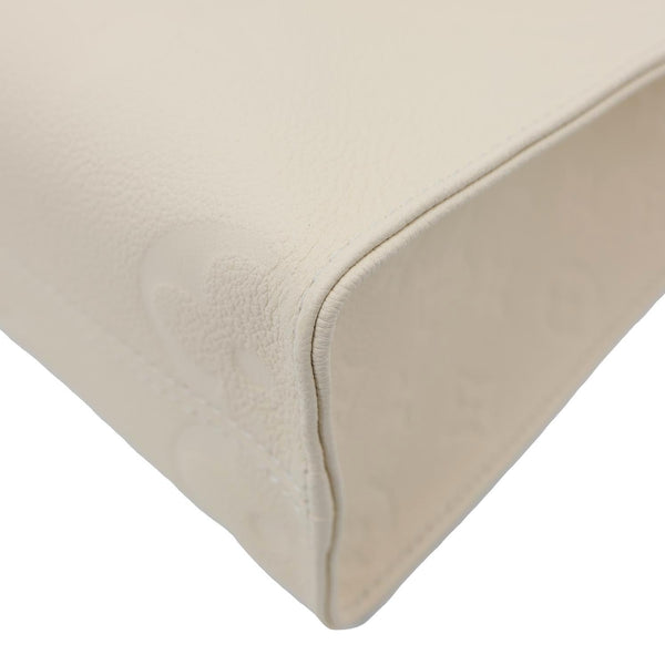 LOUIS VUITTON Onthego PM Monogram Empreinte Leather Shoulder Bag Off White