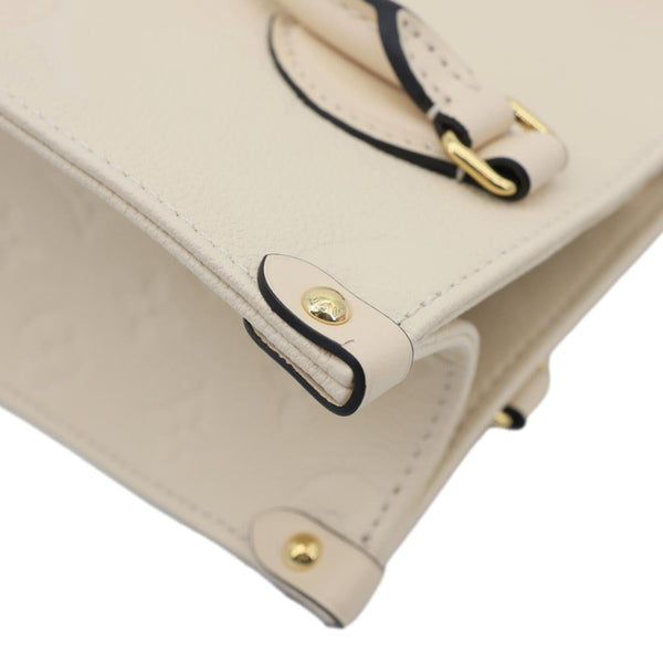 LOUIS VUITTON Onthego PM Monogram Empreinte Leather Shoulder Bag Off White