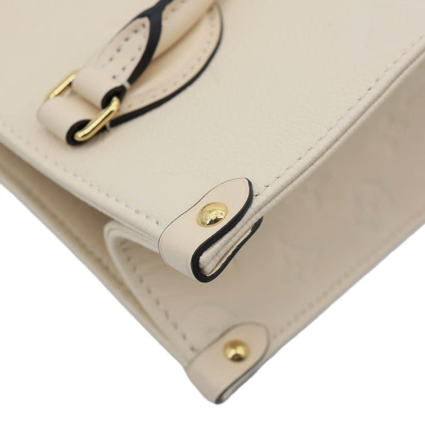 LOUIS VUITTON Onthego PM Monogram Empreinte Leather Shoulder Bag Off White