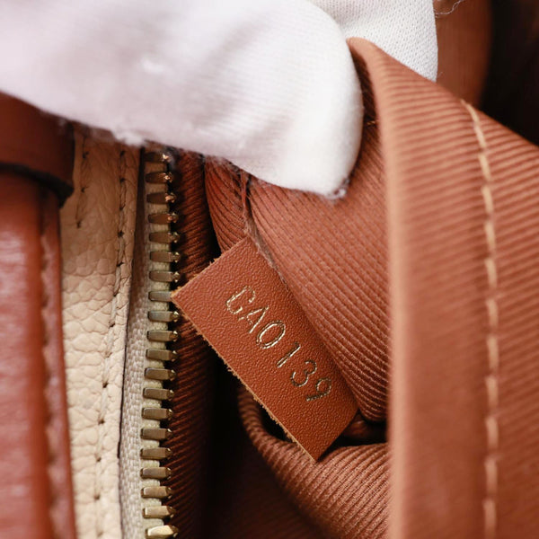 LOUIS VUITTON Saintonge Monogram Empreinte Leather Crossbody Bag Cream