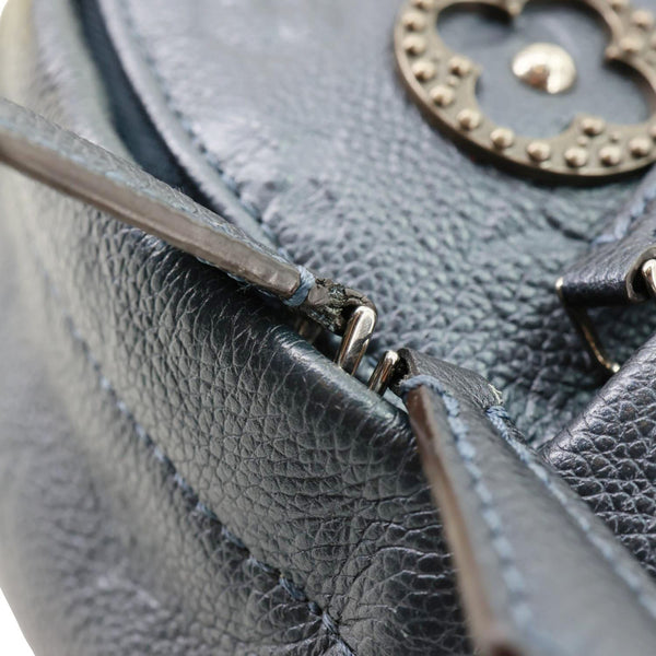 LOUIS VUITTON Flower Pins Monogram Empreinte Leather Backpack Blue