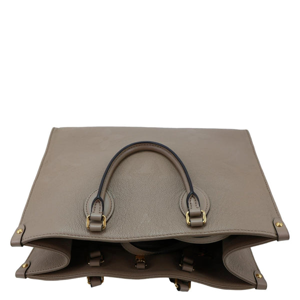 LOUIS VUITTON Onthego MM Giant Monogram Empreinte Leather Tote Bag Beige