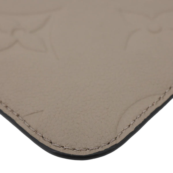 LOUIS VUITTON Neverfull Pochette Giant Monogram Empreinte Leather Wristlet Beige