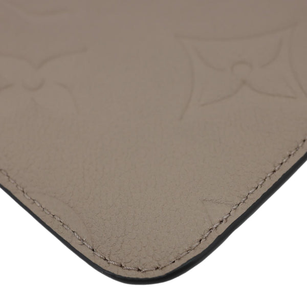 LOUIS VUITTON Neverfull Pochette Giant Monogram Empreinte Leather Wristlet Beige