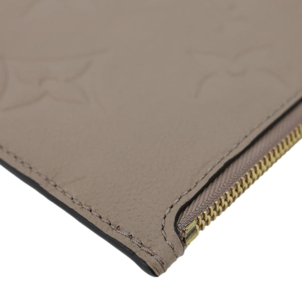 LOUIS VUITTON Neverfull Pochette Giant Monogram Empreinte Leather Wristlet Beige