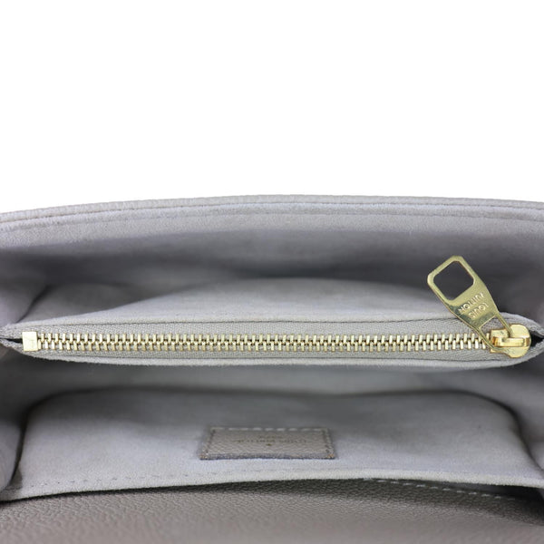 LOUIS VUITTON Metis East West Pochette Empreinte Leather Crossbody Bag Beige