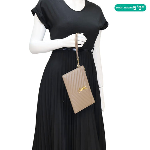 YVES SAINT LAURENT Large Bill Cream Monogram Grain De Paoudre Pouch - Model Holding