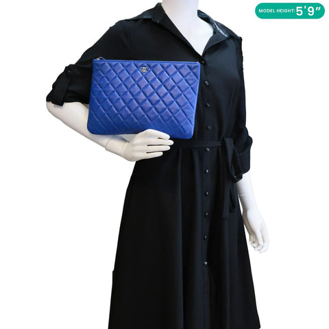 CHANEL O Case Large Quilted Lambskin Leather Clutch Blue