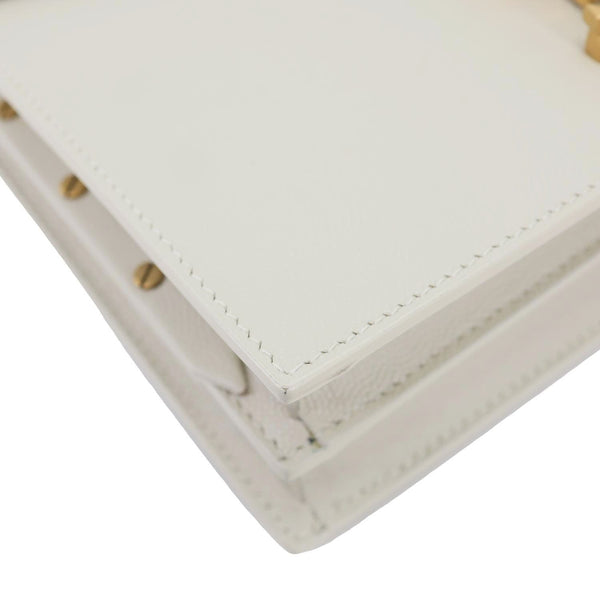 YVES SAINT LAURENT Cassandra Monogram Clasp Grain De Poudre Crossbody Bag Off White