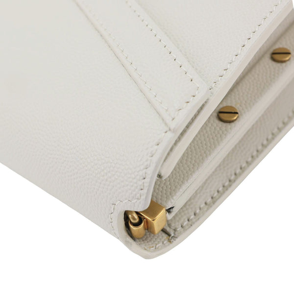 YVES SAINT LAURENT Cassandra Monogram Clasp Grain De Poudre Crossbody Bag Off White