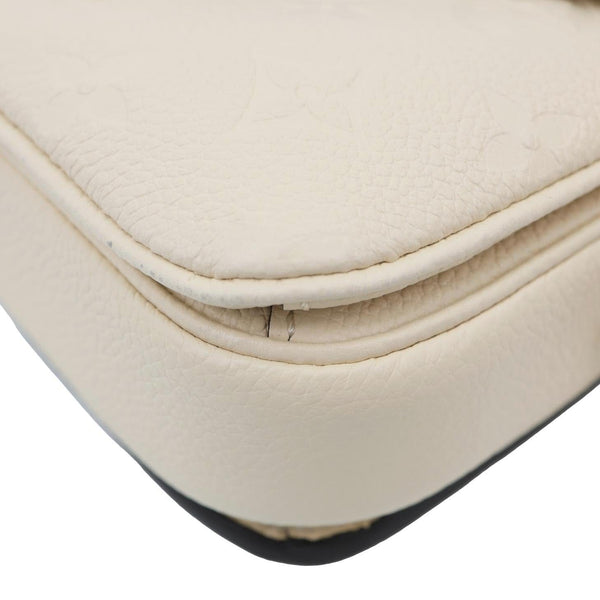 LOUIS VUITTON Metis East West Pochette Empreinte Leather Crossbody Bag Cream