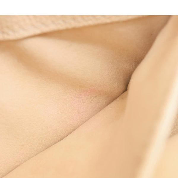 LOUIS VUITTON Metis East West Pochette Empreinte Leather Crossbody Bag Cream