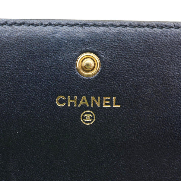CHANEL Camellia Gusset Flap Embossed Lambskin Leather Wallet Navy Blue
