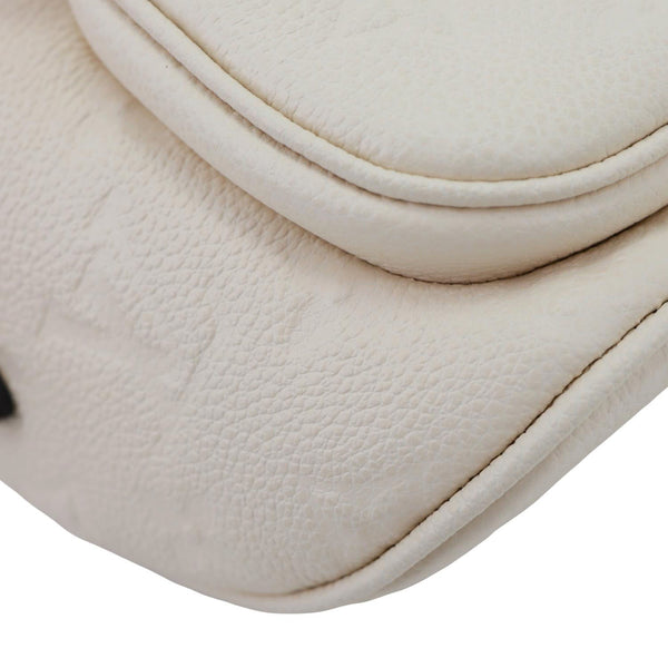LOUIS VUITTON Mini Monogram Empreinte Leather Bumbag Cream