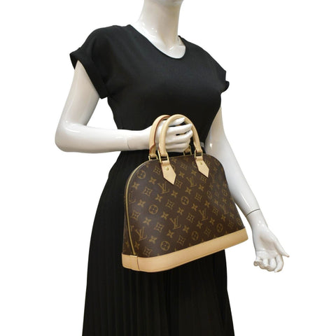LOUIS VUITTON Alma Monogram Canvas Satchel Bag Brown