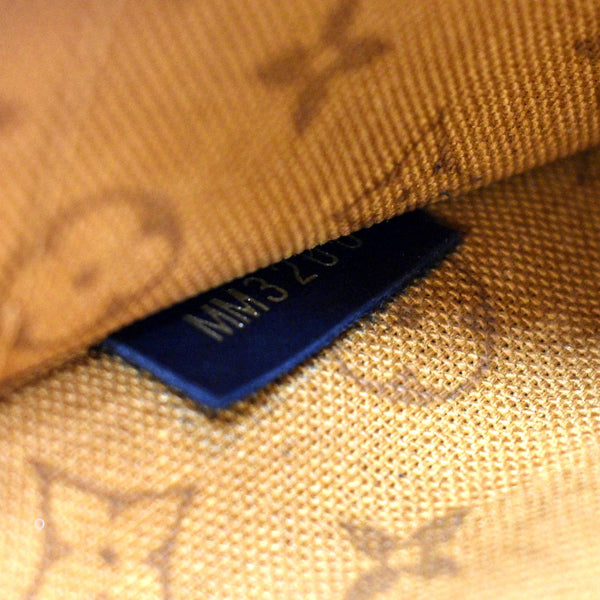 LV Neverfull Crafty Monogram Giant Wristlet Pouch Brown