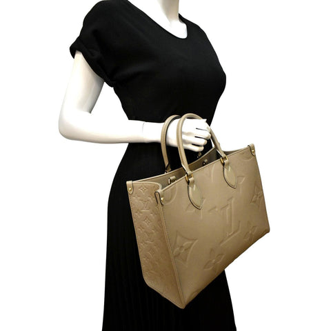LOUIS VUITTON Onthego MM Giant Monogram Empreinte Leather Tote Bag Beige