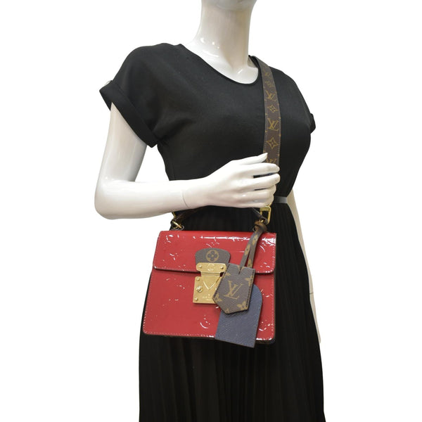 LOUIS VUITTON Spring Street Crossbody Bag red color with body view