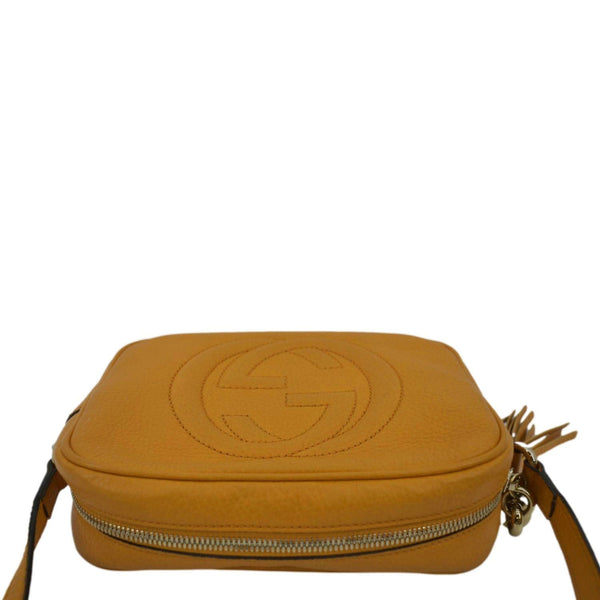 GUCCI Soho Disco Elegance: Leather Crossbody Bag Orange with land scap view