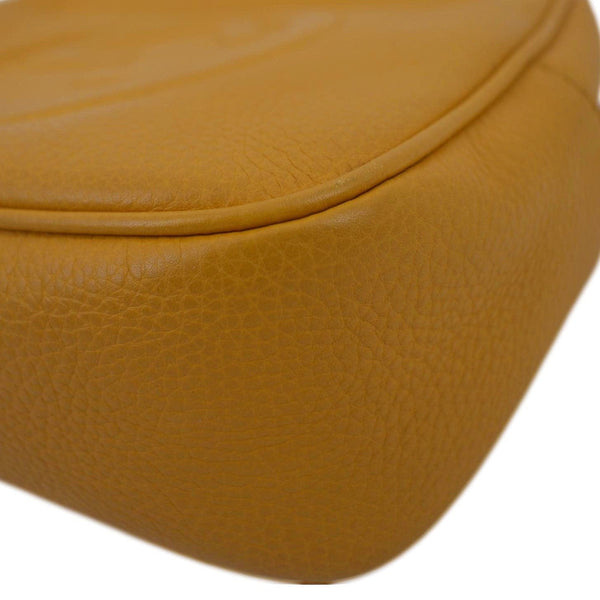 GUCCI Soho Disco Elegance: Leather Crossbody Bag Orange with left side view