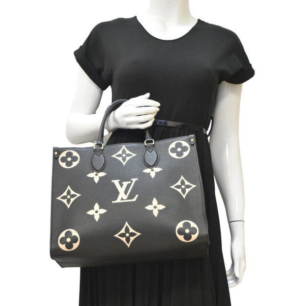 LOUIS VUITTON Onthego MM Giant Monogram Empreinte Leather Tote Bag Bicolor