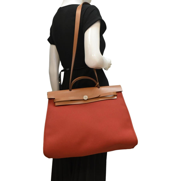 HERMES HerbagTote Shoulder Bag Canvas/Leather Red/brown with body view