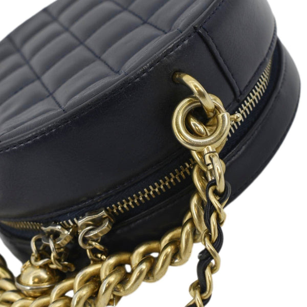 CHANEL Navy Glazed Round As Earth Leather Crossbody Bag with left side chain view